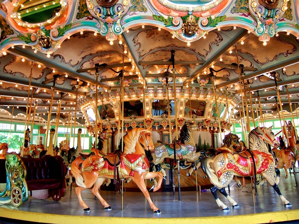 A colorful carousel with horses and lights and mirrors at Glen Echo Park