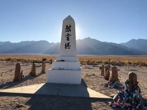 Memorial obelisk with a mountain range in the background at Manzanar National Historic Site