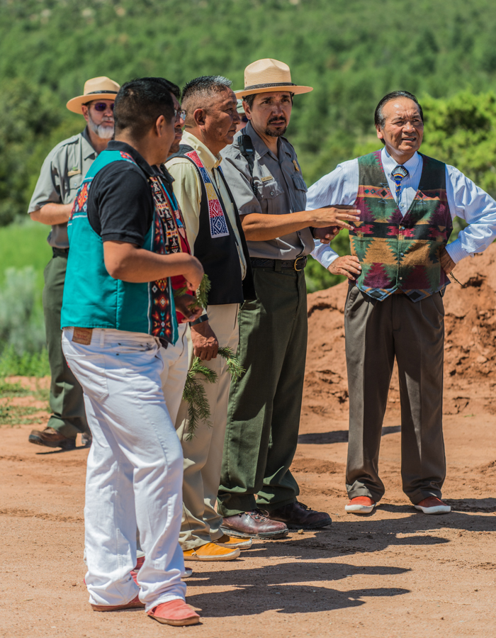 Park staff talks with tribal representatives from the Pueblo of Jemez during Feast Day celebrations at Pecos National Historical Park
